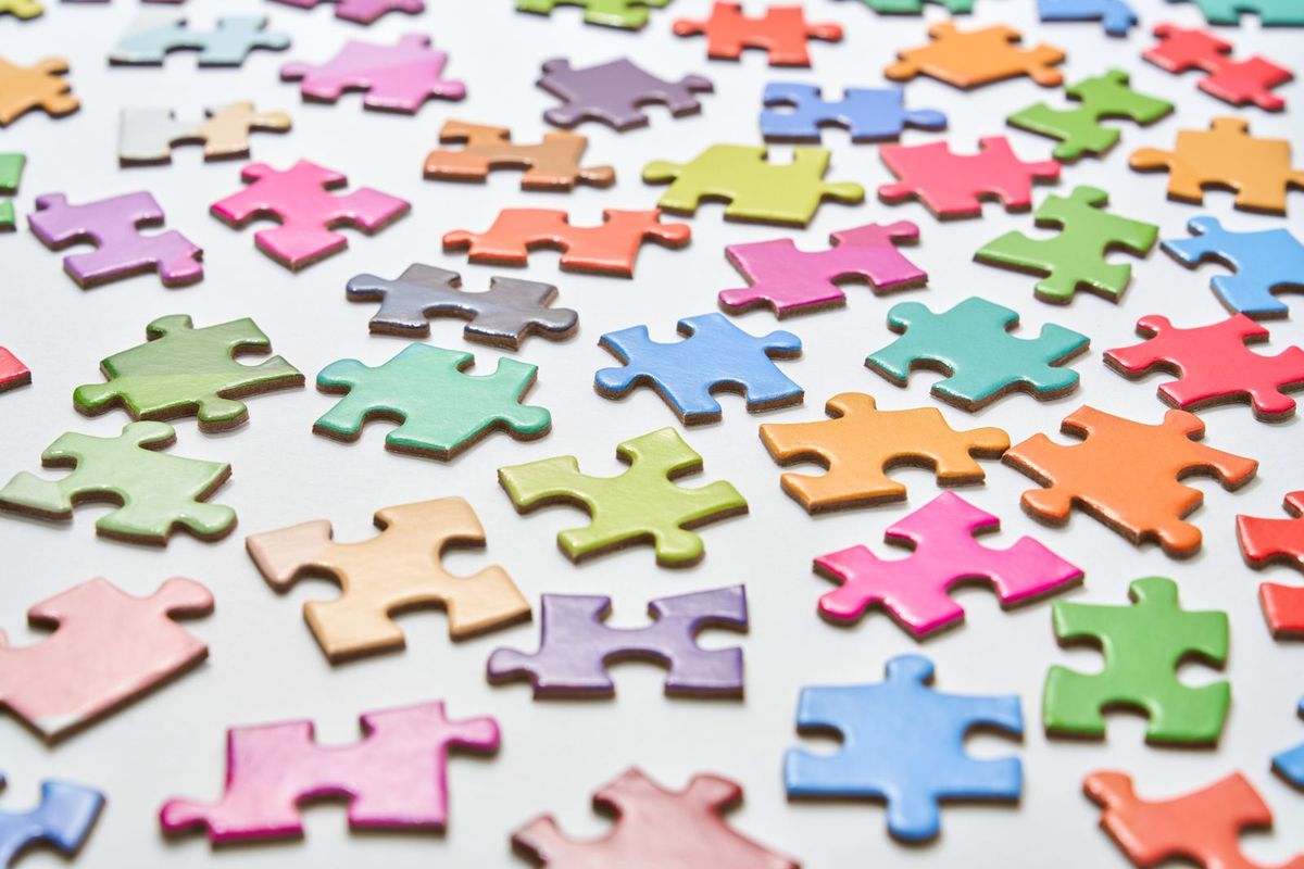 Colorful jigsaw puzzle pieces — screen-free brain game for seniors