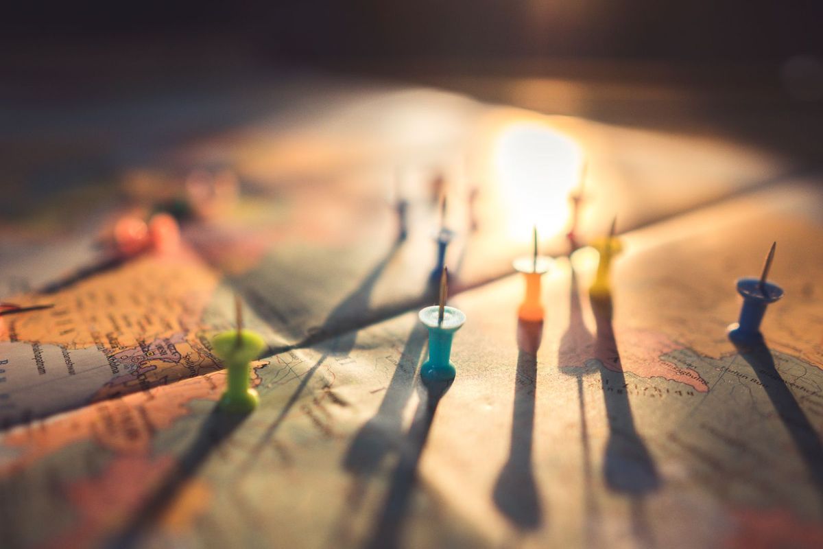 Framed world map or push-pin map — travel gift for seniors